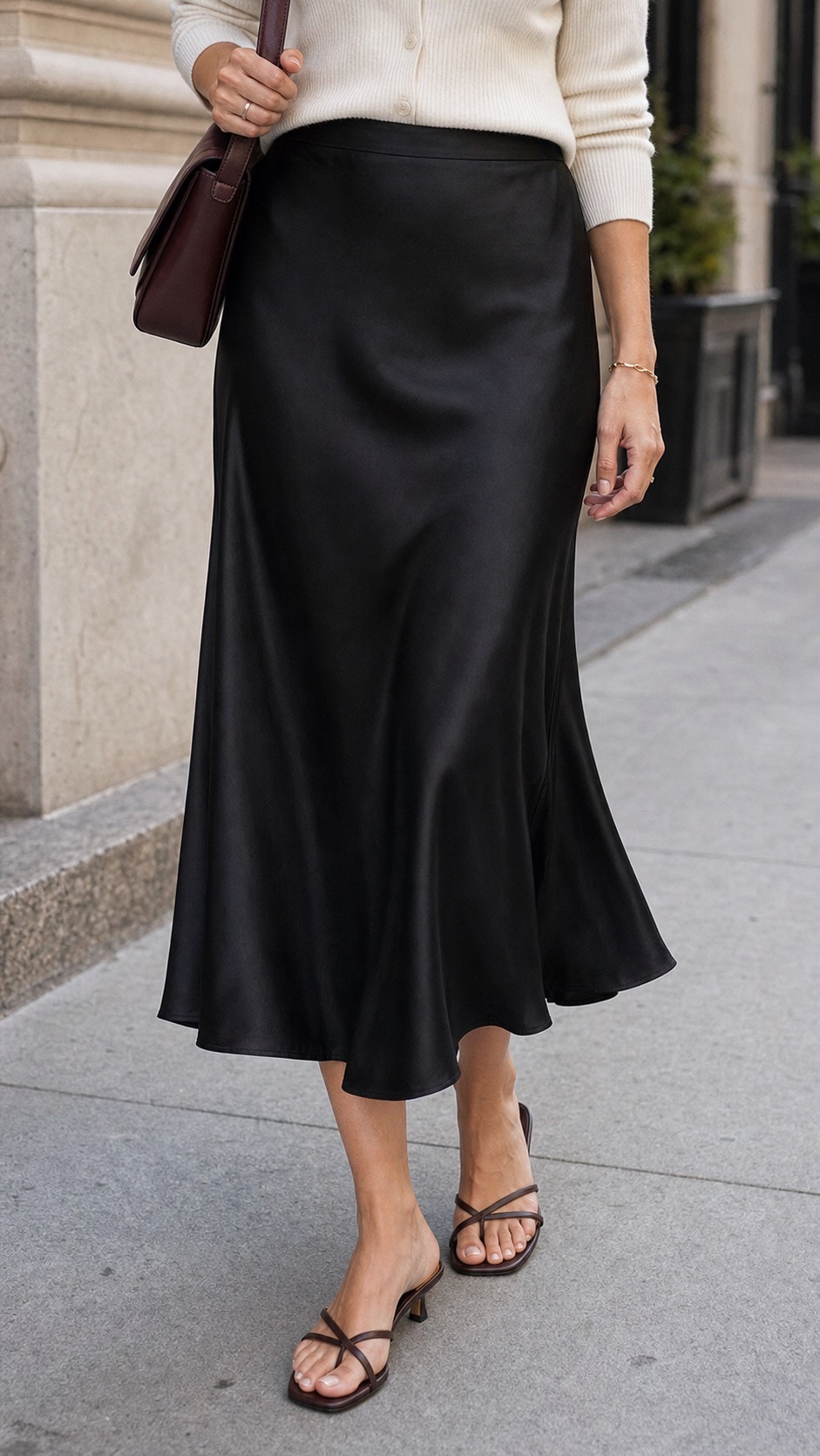 black slip skirt outfits reference image 6: A closer look at the skirt fabric, hem movement, and shoe balance
